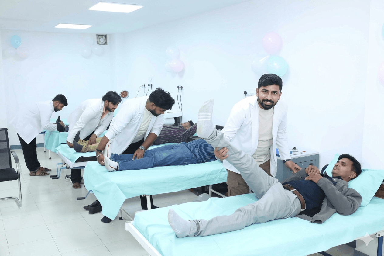 Physiotherapists treating multiple patients in active clinic session